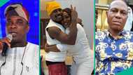 Asake's mum makes money rain on KWAM 1 at event, video ignites concerns about singer's dad