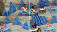 "Una don try": Nigerian triplets finish 168 tins of Peak baby milk, mum shares video of plenty empty cans
