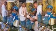 "I like this tradition": Groom sprays wife money, tries hard to make her smile, gives out bundles of cash