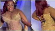 Waist trainer no train anything: Reactions to video of lady in fitted dress looking uncomfortable