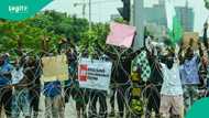 Photos show hungry, young protesters arraigned in Abuja court being fed biscuits