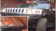 Shock as billionaire buries his mom in Hummer Jeep, splashes the expensive 'coffin' with dollars