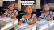 "Na by force?" Kid cries, holds pencil as she tries to do maths homework, mum films her drama