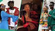 "So cute": Mr Eazi holds Temi's slender waist as she whines for him during her birthday dinner