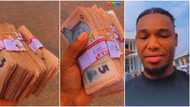 "You are rich": Nigerian man who went to withdraw money gets plenty bundles of N5 notes, video emerges