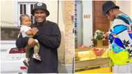 Daddy duties: Comedian Oluwadolarz seen backing his baby in adorable photo