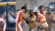 "You dey whine me?" Angry Lagos bus conductor grips man by the shirt after getting pranked with money in video