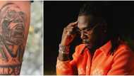 This is lit: Nigerians react as die-hard fan tattoos Burna Boy's face on his arm