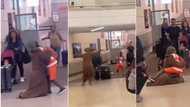 "I left him 11 years ago": Tears as woman falls to floor after meeting son in US, hugs him tightly in video