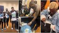 Zazu crooner Portable prostrates as he meets Davido, Imade for first time, quickly hides his dollars From Poco