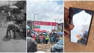 "Just be safe": Another young man bends down with his phone in Lagos market to find spirits, shares result