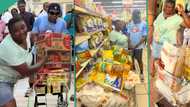 Fast Naija lady carries bags of rice, spaghetti, groundnut oil during free Shopping at supermarket