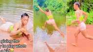 "I no play when I small": Lady who was raised by military dad visits river to pack sand, video causes buzz
