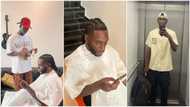 Much talented young Nigerian barber makes it in life, gives Burna Boy fine haircut, photos go viral
