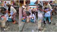 Lady finishes school, rushes to market & kneels in dirty water before mum, she signs on her shirt