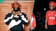 Burna Boy sleeps on a plane, photo gets interesting reactions: "Body no be firewood"