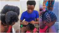 Young Nigerian man gets people talking after plaiting girl's hair with great skill in viral video