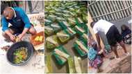 Young Nigerian man cooks food, puts N200 on top, gives them to beggars in viral photos