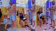 "People get money o": Nigerian man welcomes wife from labour room with wads of cash, video trends