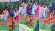 "Is she a snake?" Fine girl in native wrapper twists her waist gently in front of crowd, video stuns many