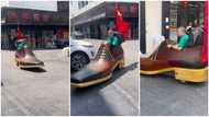 "I need the second leg:" Man caught driving giant shoe car in China, video goes viral