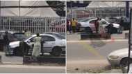 Video shows policemen in Delta leave their duties to help replace lady's car flat tyre, sparks reactions