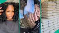 Female cement seller displays cash she made from business, video inspires many