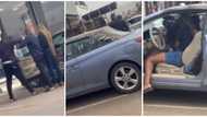 Nigerian man catches his girlfriend in a car with another man at mall, retrieves an expensive gift he got her