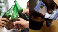 Man shows off the large amount of money he saved after he stopped drinking beer