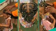 Father plaits baby's hair, braids it like pro in UK, Nigerians ask questions