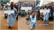 "Na cash dis baba collect": Photographer dances with great energy at party, holds his camera tight