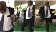 Wetin dey sweet am? Old man in suit turns heads in bar, gives one-leg dance moves with wine in his hand