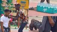 Emotional moment final year student kneels down for boy who hawks "pure water" to sign on his shirt goes viral