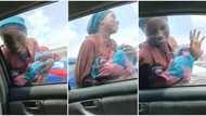 "She must be arrested": Viral video exposes how lady uses fake baby to beg, make money in Lagos