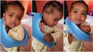 "She is in trouble": Baby girl gets stuck after putting her head in narrow object, begs mum for help in video