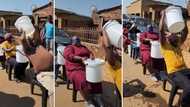 Blindfolded men and women mess themselves up as they do the water bucket challenge, funny clip stirs reactions
