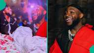 Davido's die-hard fan shares video of bedroom with large posters of OBO: "I dream about him"