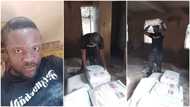 Young Nigerian man offloads bags of cement, says he charges N30 per bag to make money, photos stir reactions