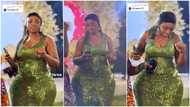Curvy lady in heels moves waist gently during wedding ceremony, steals show, camera focuses on her