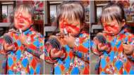 "Can your children do this?" Girl uses mum's red lipstick to design her face, video goes viral