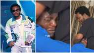 Olamide makes upcoming star cry profusely in emotional video as young man refuses to let rapper go