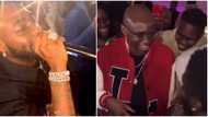 I will never be broke in my life: Reactions as Pastor Tobi sprays Davido with bundles of pound notes in UK
