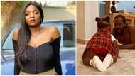 Fans in awe as Simi and Adekunle Gold's daughter crawls, poses for photo in new video