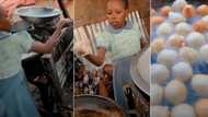 "See person wey I old pass": Little girl in school uniform helps her mum fry Puff Puff, video inspires many