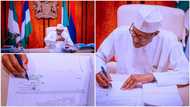 Breaking: Buhari finally signs Petroleum Industry Bill into law, photos show president's special signature