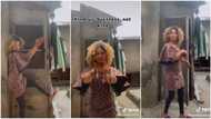 "Mind your business": Lady dances in front of her old-looking house with rusted roofs without shame in video