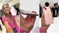 Apple Event: Lady handles new iPhone 15 pink version, operates it, excited about USB-C