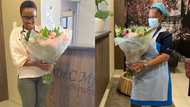 Pretty female doctor emotional as she receives beautiful flowers from her patient,shares photo