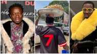 Michael Blackson carries pan on his head, holds blue bucket, takes to the streets of Accra to sell peanuts