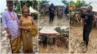 Nigerian couple and their guests ignore heavy downpour as they carry on with wedding, photos melt hearts